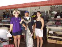 Felipe, Valerie & I with a big tuna our favorite fish market